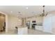 Modern kitchen with stainless steel appliances and large center island for additional workspace and seating at 121 Porta Vecchio Bnd # 201, Nokomis, FL 34275