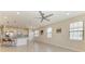 Open-concept living room features tile floors, lots of natural light, and connects to a modern kitchen at 121 Porta Vecchio Bnd # 201, Nokomis, FL 34275