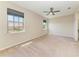 The primary bedroom has carpet flooring, two windows and a ceiling fan at 121 Porta Vecchio Bnd # 201, Nokomis, FL 34275