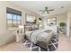 Well-decorated primary bedroom boasts a calming color palette and ample natural light at 121 Porta Vecchio Bnd # 201, Nokomis, FL 34275