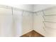 Uncluttered walk-in closet with wire shelving, providing ample storage space at 121 Porta Vecchio Bnd # 201, Nokomis, FL 34275
