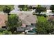 Aerial view of a home with screened-in pool and well-maintained lawn at 12358 Lavender Loop, Bradenton, FL 34212