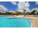 Beautiful community pool and splash pad with water feature slide, ideal for Gathering fun and relaxation at 12358 Lavender Loop, Bradenton, FL 34212