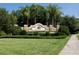 Attractive GreyHawk Landing neighborhood entrance sign with manicured landscaping, and mature palm trees at 12358 Lavender Loop, Bradenton, FL 34212
