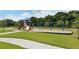 Community playground with a slide, swings, and a safe, grassy play area at 12358 Lavender Loop, Bradenton, FL 34212