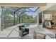 Inviting screened-in lanai with pool, lounge seating and a view of lush landscaping at 12358 Lavender Loop, Bradenton, FL 34212