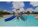 Splash pad and slide at community pool promises endless entertainment for children and families in a safe environment at 12358 Lavender Loop, Bradenton, FL 34212