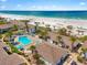 Beautiful aerial view of beachside condos, pool, and easy beach access at 1255 E Peppertree Dr # 507, Sarasota, FL 34242