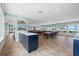 Spacious clubhouse with tables, chairs, and stunning beach views at 1255 E Peppertree Dr # 507, Sarasota, FL 34242