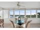 Bright dining area features water views, glass table and comfortable seating, creating an inviting space at 1255 E Peppertree Dr # 507, Sarasota, FL 34242