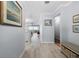 Inviting hallway with tile floors, neutral paint and views of the living spaces at 1255 E Peppertree Dr # 507, Sarasota, FL 34242