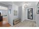 Stylish hallway featuring wood-look tile, and convenient entryway bench at 1255 E Peppertree Dr # 507, Sarasota, FL 34242