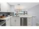 Beautiful kitchen with stainless steel appliances and an opening to the living space at 1255 E Peppertree Dr # 507, Sarasota, FL 34242