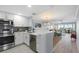 Bright, open kitchen with stainless steel appliances and seamless flow into the living area at 1255 E Peppertree Dr # 507, Sarasota, FL 34242