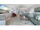 Bright and airy living room with coastal decor flows seamlessly into dining area at 1255 E Peppertree Dr # 507, Sarasota, FL 34242