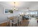 Bright and airy living room and dining area with tile floors and comfortable furnishings at 1255 E Peppertree Dr # 507, Sarasota, FL 34242