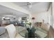 Cozy living area complemented by a round glass table at 1255 E Peppertree Dr # 507, Sarasota, FL 34242