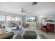 Bright living area with coastal decor and floor to ceiling windows offering a panoramic view at 1255 E Peppertree Dr # 507, Sarasota, FL 34242