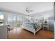 Serene main bedroom with balcony access, shutter doors and ample natural light at 1255 E Peppertree Dr # 507, Sarasota, FL 34242
