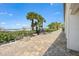 Community outdoor grilling area near the beach and palm trees at 1255 E Peppertree Dr # 507, Sarasota, FL 34242