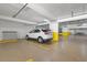 Secured parking garage with assigned parking spaces in a well-lit, modern facility at 1255 E Peppertree Dr # 507, Sarasota, FL 34242
