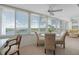 Bright sun room with lots of windows offering expansive water views at 1255 E Peppertree Dr # 507, Sarasota, FL 34242