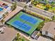 Aerial view of community tennis courts, perfect for sports enthusiasts and social gatherings at 1255 E Peppertree Dr # 507, Sarasota, FL 34242