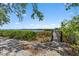 Pathway leads to scenic view of a calm waterway and green foliage at 1255 E Peppertree Dr # 507, Sarasota, FL 34242