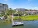 Scenic waterfront view featuring lush greenery and a private dock at 1255 E Peppertree Dr # 507, Sarasota, FL 34242