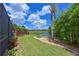 Well-manicured backyard with lush landscaping and a tranquil lake view create an inviting outdoor space at 12644 20Th E St, Parrish, FL 34219