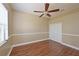 Cozy bedroom featuring hardwood floors, crown molding, and a ceiling fan at 12644 20Th E St, Parrish, FL 34219