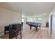 Spacious game room with pool table, bar area, and comfortable seating, perfect for entertaining at 12644 20Th E St, Parrish, FL 34219