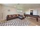 Bright game room with pool table, cozy seating area, and laminate wood flooring at 12644 20Th E St, Parrish, FL 34219