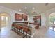 Spacious kitchen boasts stainless appliances, a large island, and ample counter space with barstool seating at 12644 20Th E St, Parrish, FL 34219