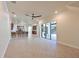 Spacious open-concept living area with tile floors, ceiling fan and access to kitchen at 12644 20Th E St, Parrish, FL 34219