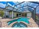 A captivating screened pool area with a spa offers relaxation and entertainment with a well-maintained patio at 12644 20Th E St, Parrish, FL 34219