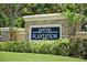 Welcoming River Plantation community sign surrounded by lush greenery offers a charming entrance at 12644 20Th E St, Parrish, FL 34219