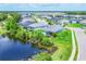 Panoramic aerial view of a neighborhood surrounded by lakes and greenery at 12755 Rainwashed Loop, Parrish, FL 34219