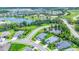 A Primary-planned community is showcased from above, highlighting the manicured lawns and inviting streetscapes of the neighborhood at 12755 Rainwashed Loop, Parrish, FL 34219