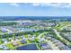 Expansive aerial view of a Primary-planned community with picturesque lakes, lush landscaping, and well-maintained homes at 12755 Rainwashed Loop, Parrish, FL 34219
