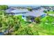 Aerial view of a beautiful home with screened-in patio overlooking a pond at 12755 Rainwashed Loop, Parrish, FL 34219
