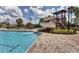 Resort-style community pool featuring a slide, splash features, and ample seating, perfect for Gathering fun and relaxation at 12755 Rainwashed Loop, Parrish, FL 34219