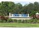 Cross Creek community sign surrounded by manicured landscaping and lush greenery at 12755 Rainwashed Loop, Parrish, FL 34219
