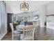 Inviting living room features a fireplace, ceiling fan, tile floors, and sliding glass doors at 12755 Rainwashed Loop, Parrish, FL 34219