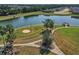 Aerial view of community park and lake with walking path and pier at 12755 Rainwashed Loop, Parrish, FL 34219