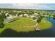 Aerial view of community park with lake, pier, and walking path at 12755 Rainwashed Loop, Parrish, FL 34219