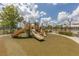Community playground featuring multiple slides and climbing structures offers a safe and engaging space for children at 12755 Rainwashed Loop, Parrish, FL 34219