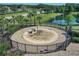 Community splash pad with water features, surrounded by black metal fence at 12755 Rainwashed Loop, Parrish, FL 34219