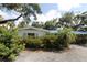 Charming single-story home with colorful shrubbery at 129 Pierson Ln, Sarasota, FL 34242