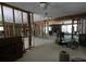 Open-concept living room leads to brick fireplace at 129 Pierson Ln, Sarasota, FL 34242